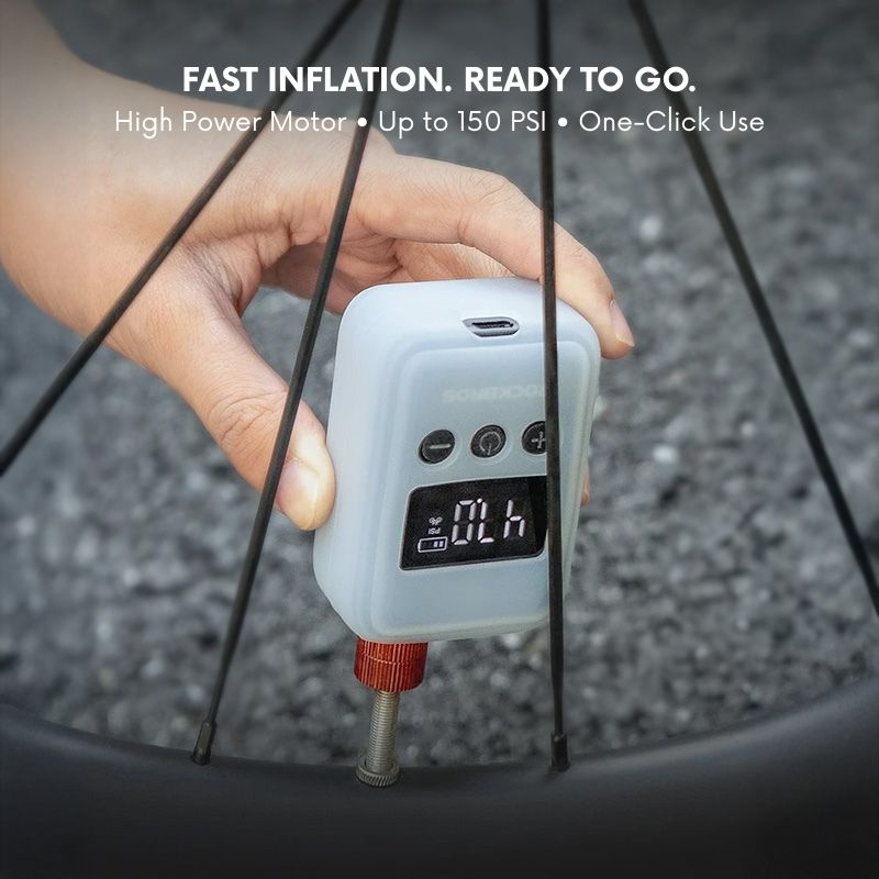 Hand holding a digital air pump next to a bicycle tire with text about fast inflation.